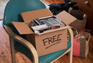 carton of free CDs and DVDs